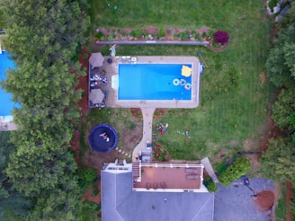 an aerial view of a house with a swimming pool