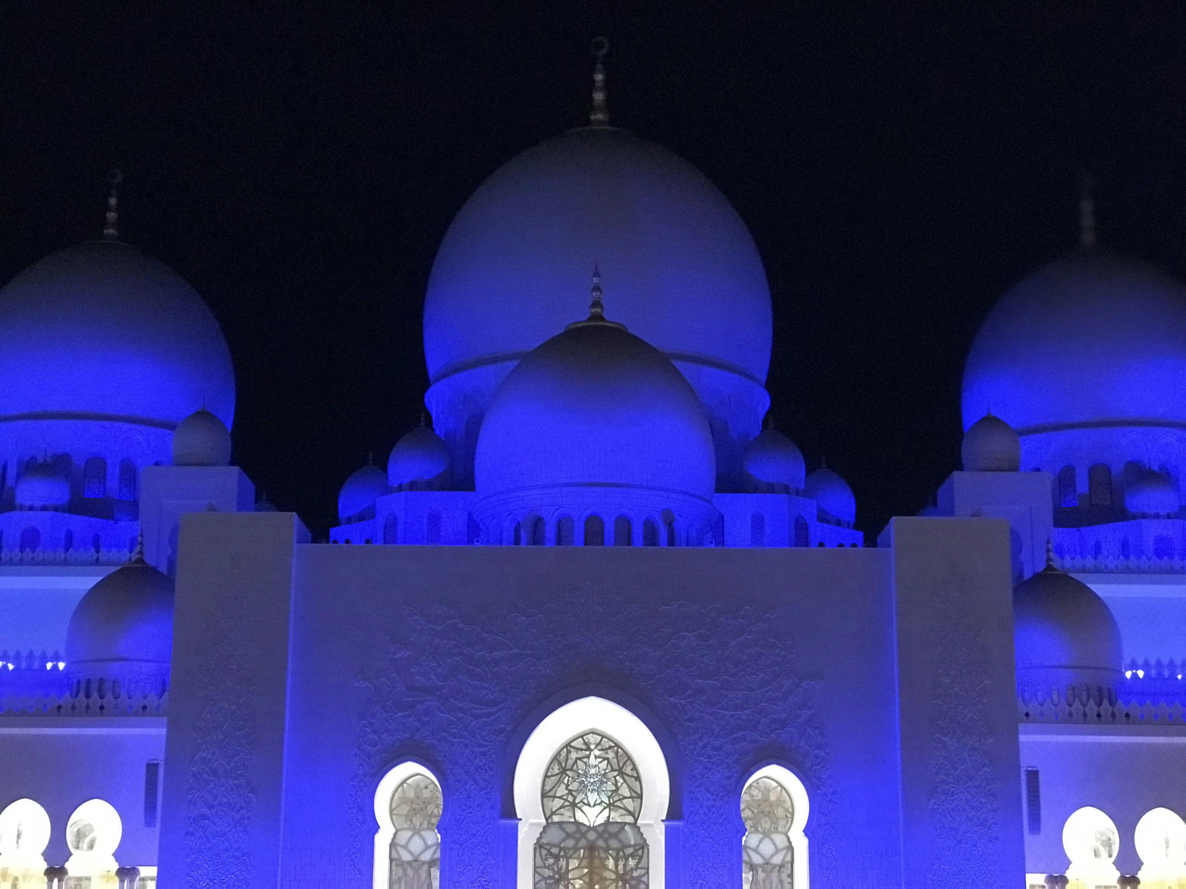 White mosque building with clock