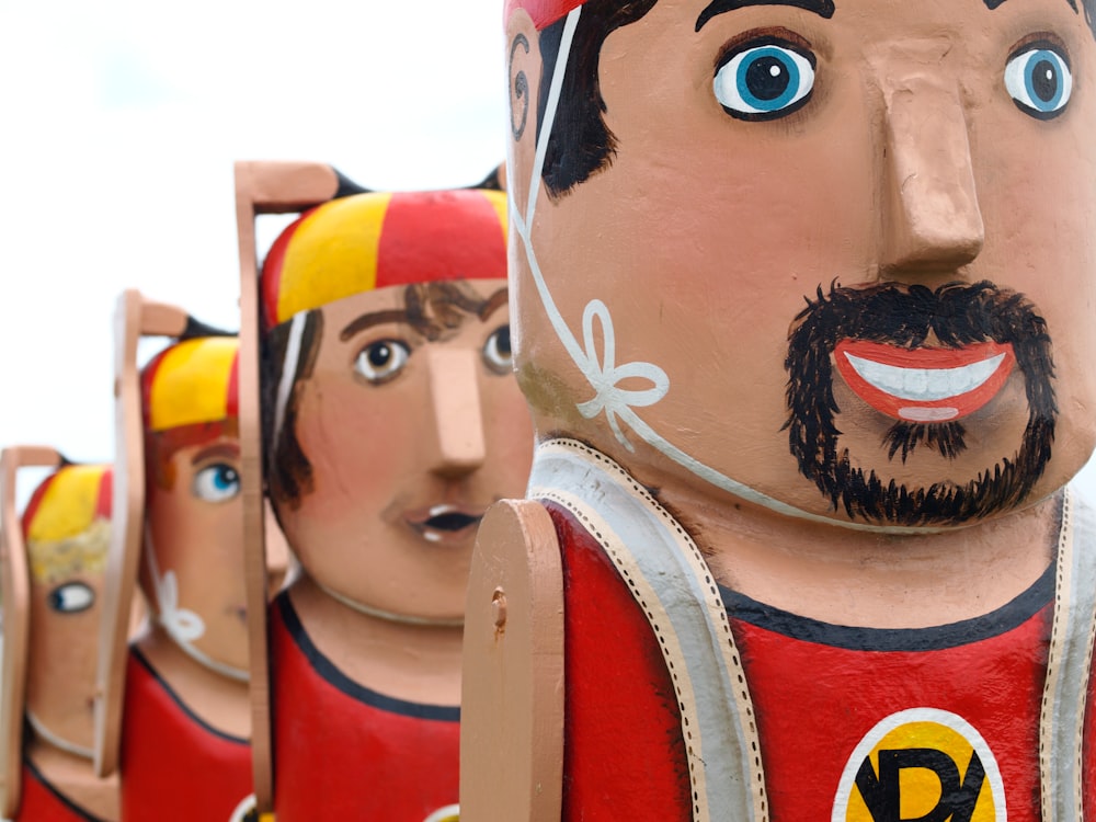 four person wooden dolls