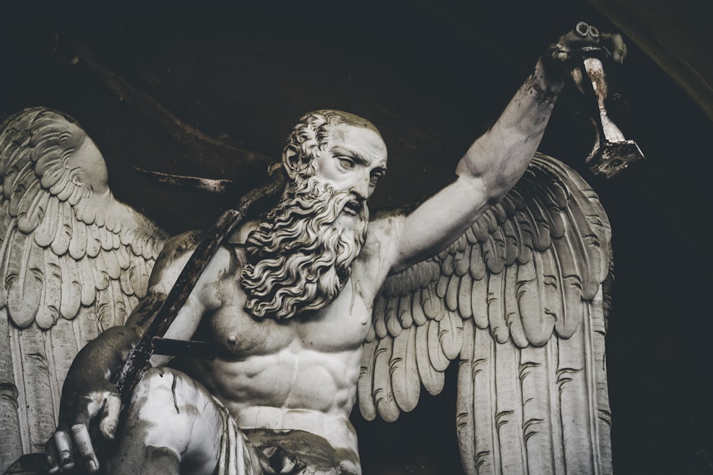 winged man statue