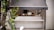 A happy client showcasing their new outdoor kitchen.
