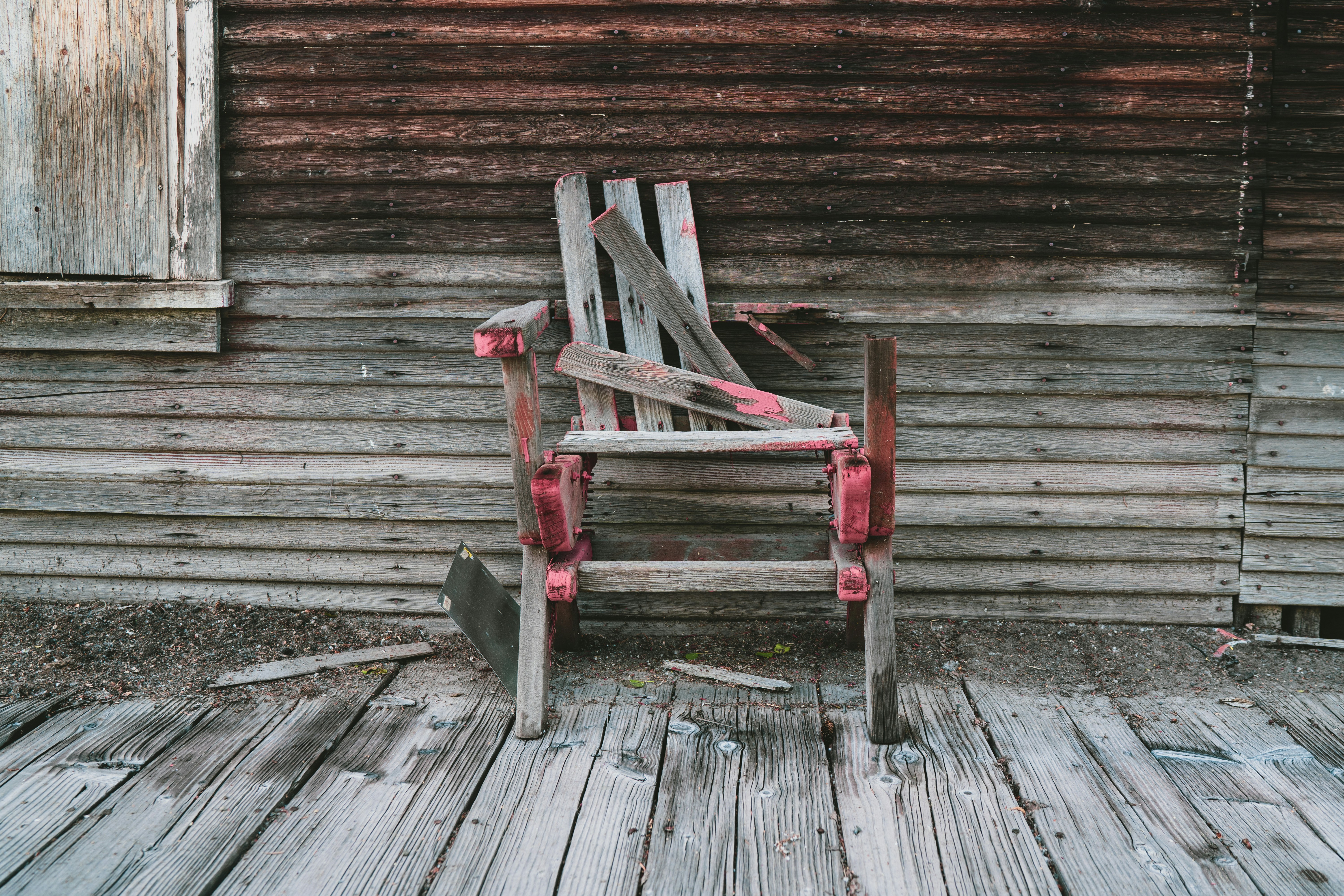 brown wooden broken furniture outside the shed
