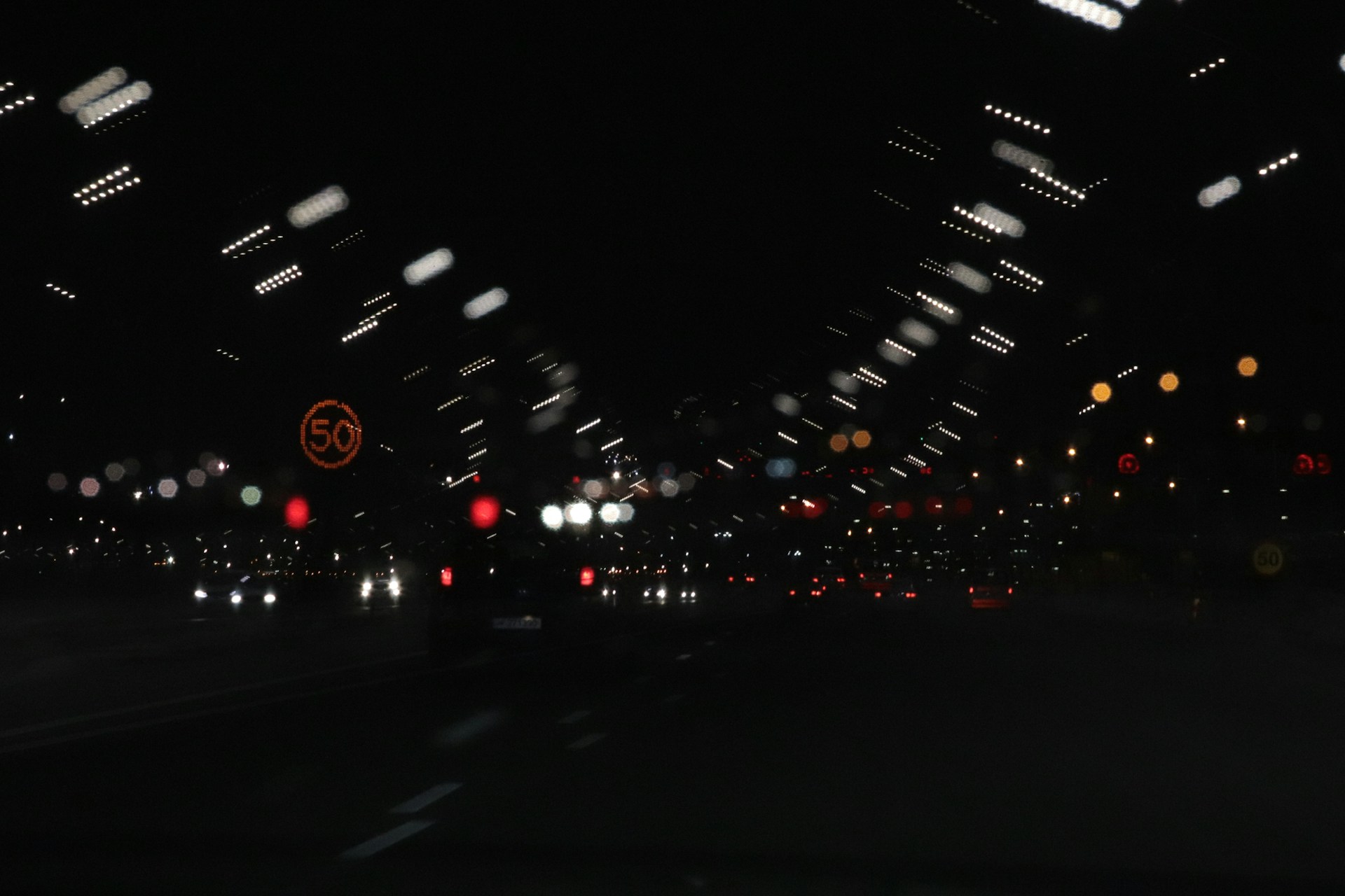 a blurry photo of a city street at night
