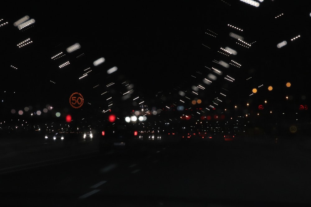 a blurry photo of a city street at night