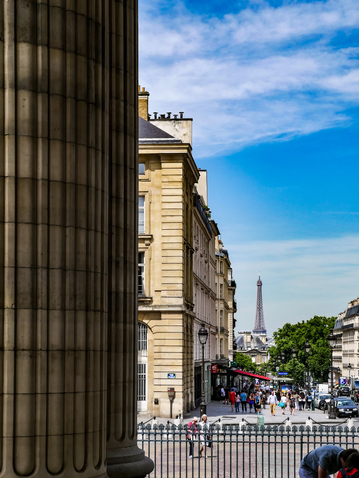 Historic European buildings with classical architecture along a scenic waterway