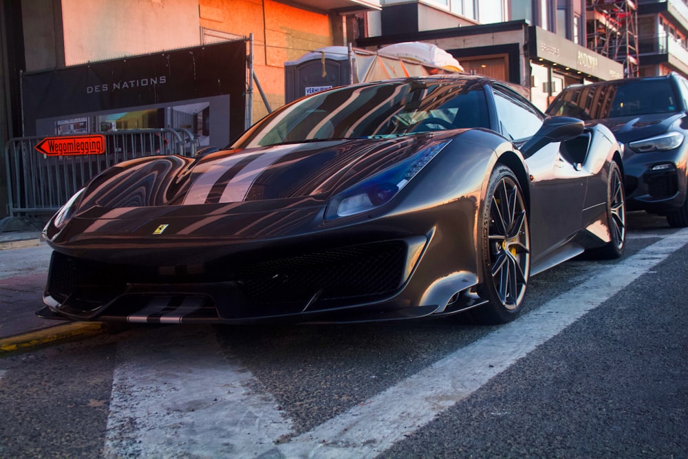 black sports car on sidewalk