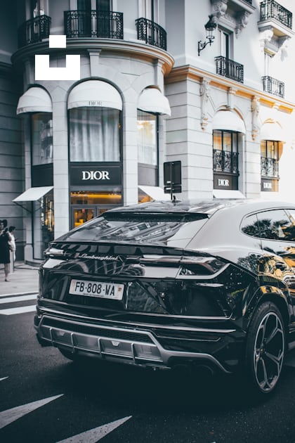 Black car photo across Dior store photo – Free Car Image on Unsplash