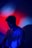 photo of man wearing white shirt with red and blue light background