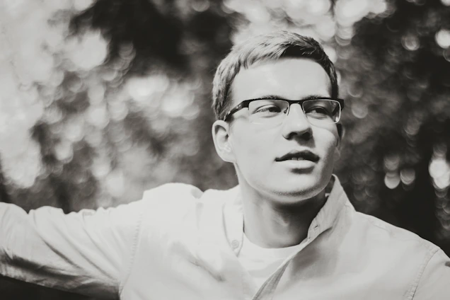 Professional portrait of Dr. Amit Sangwan in a modern academic setting with subtle glassmorphism effects.