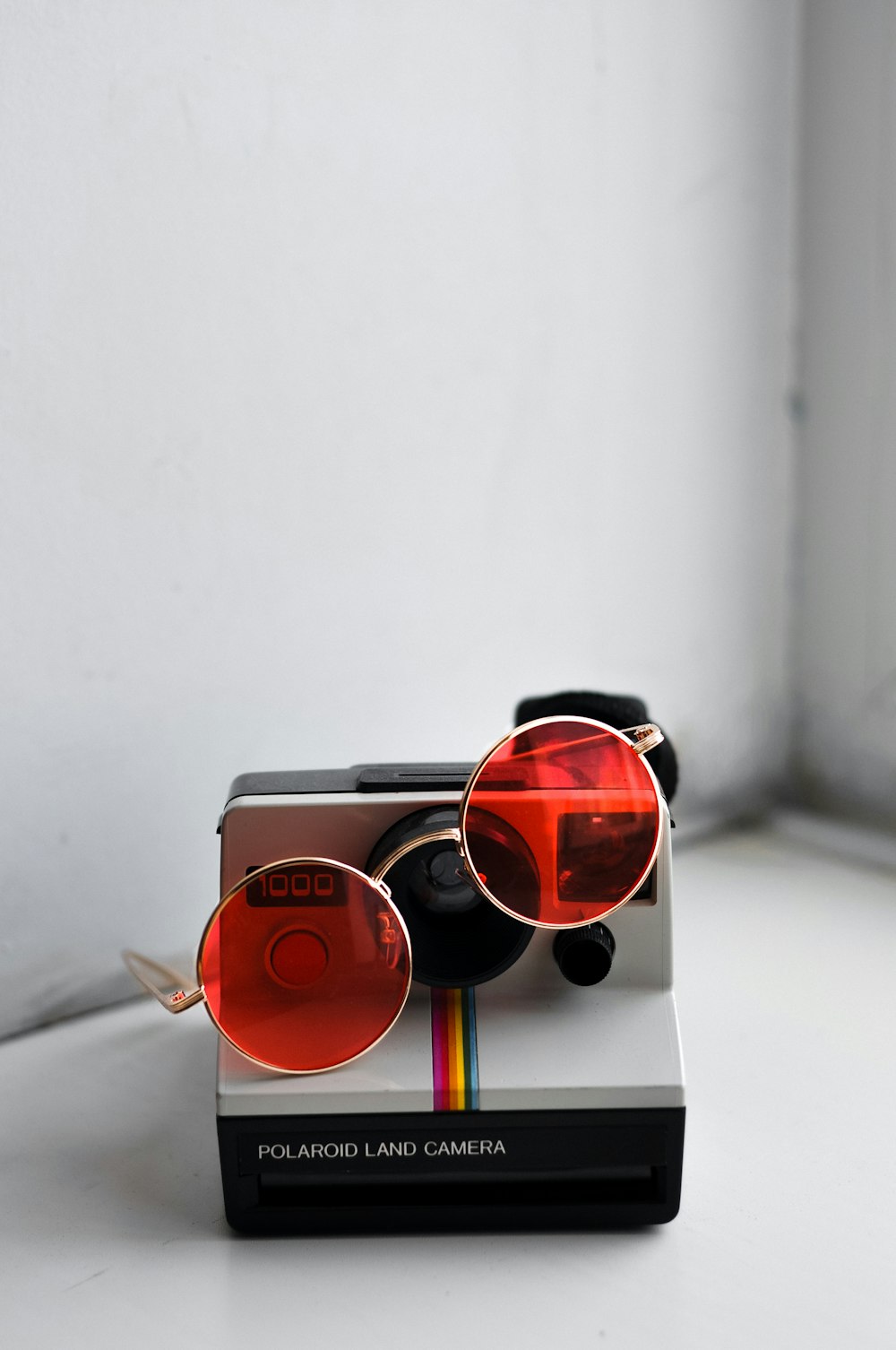 gold-framed red hippie sunglasses