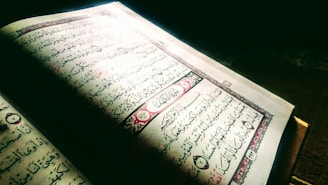 An open book with Arabic calligraphy on the pages