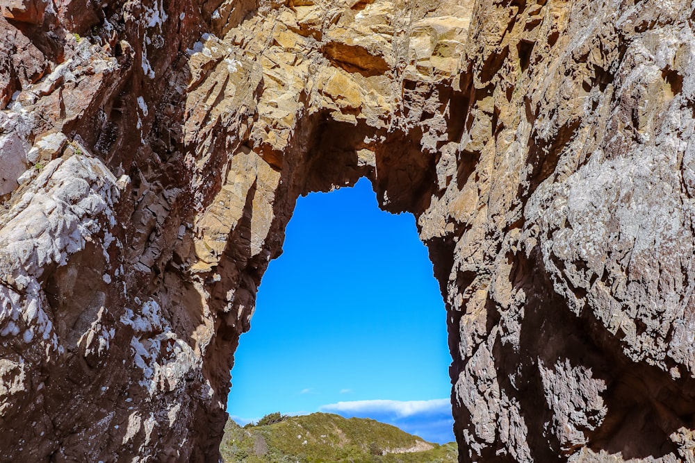 Cave Entrance With Clouds And Mountain In Background Photo Free Naramata Image On Unsplash