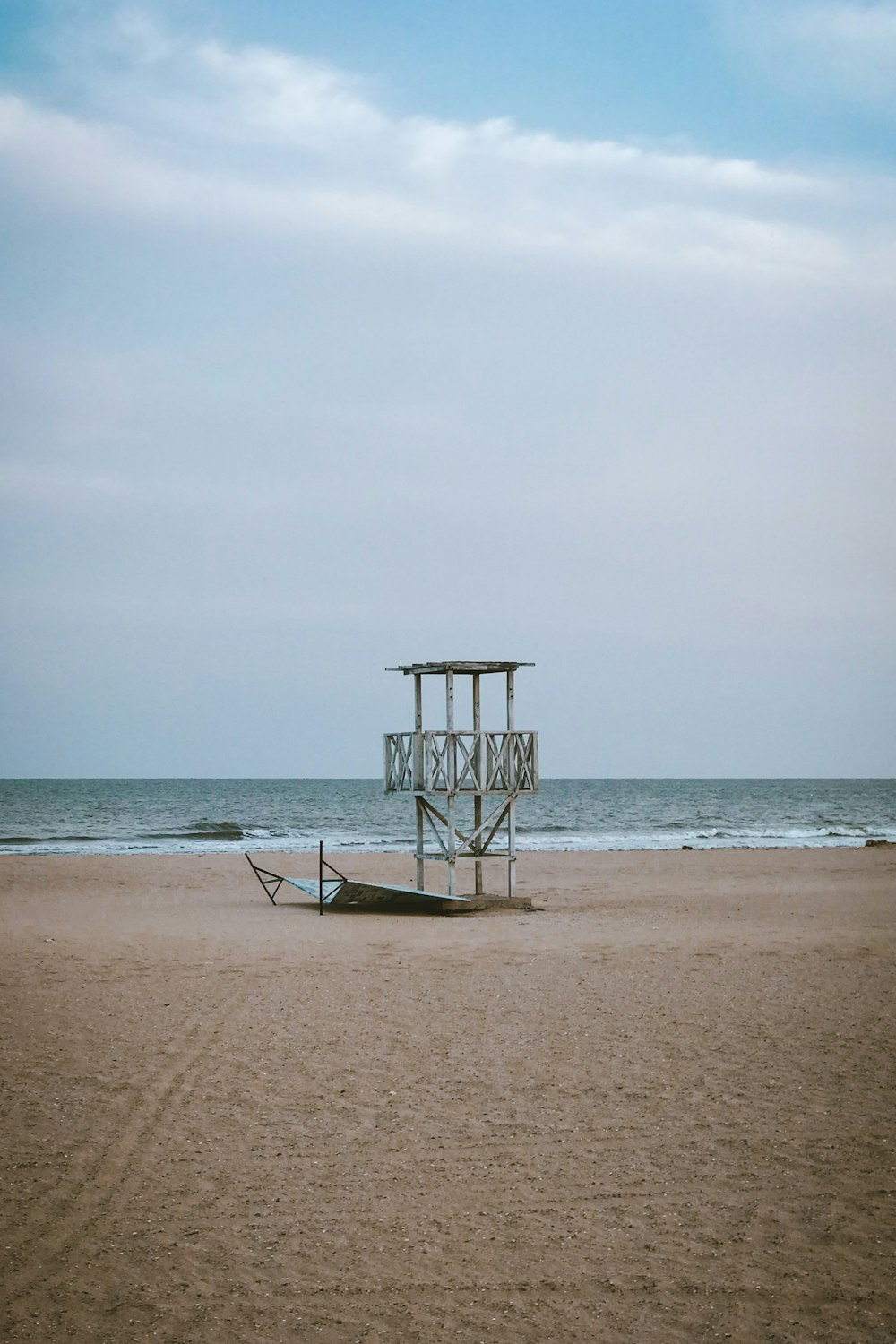 white watch tower on beach