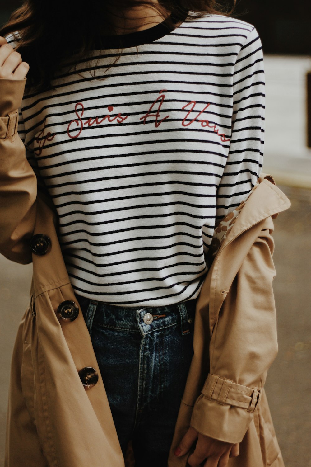 woman in a brown trench coat