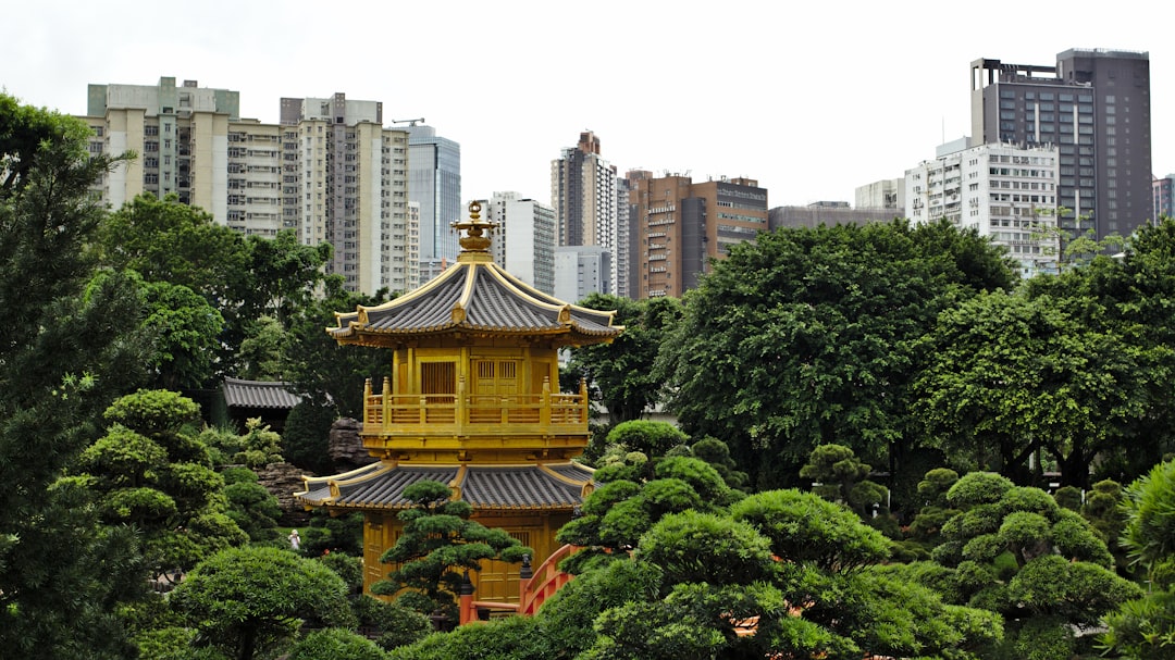 yellow and orange temple surrounded with trees
