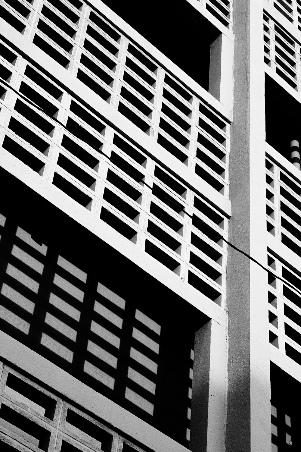 a black and white photo of a tall building