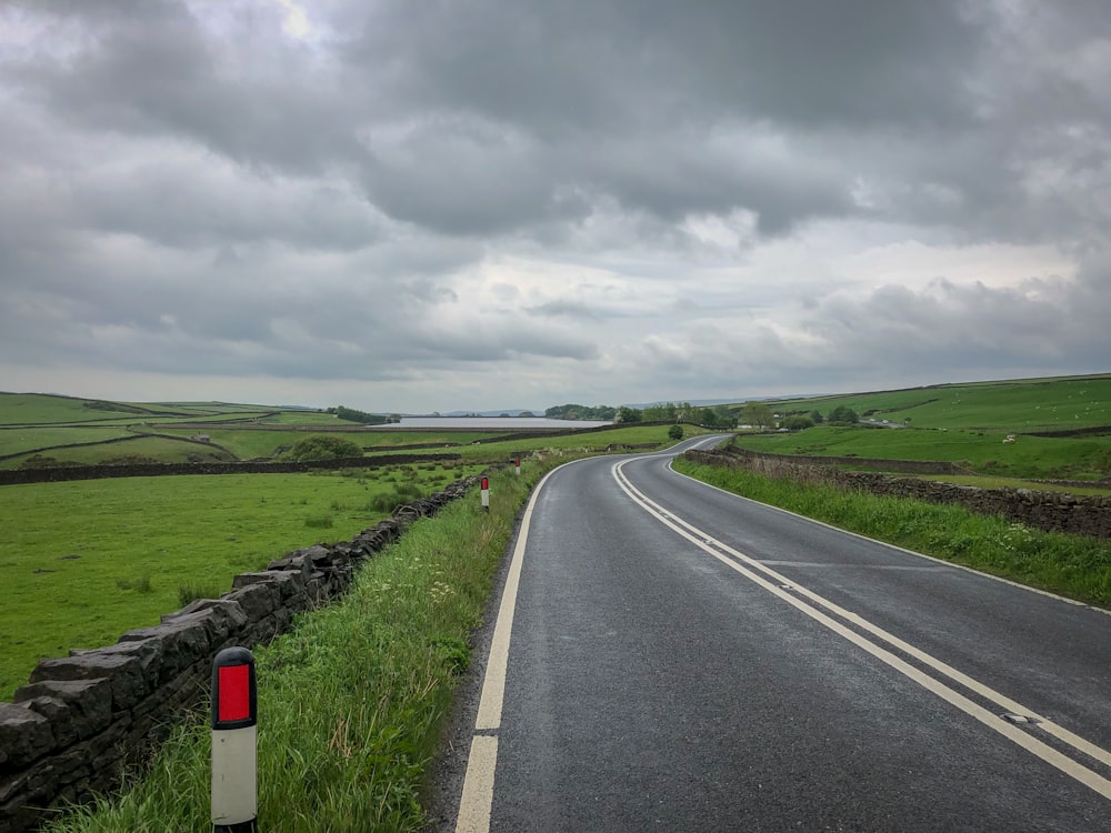 a road with a red light on the side of it