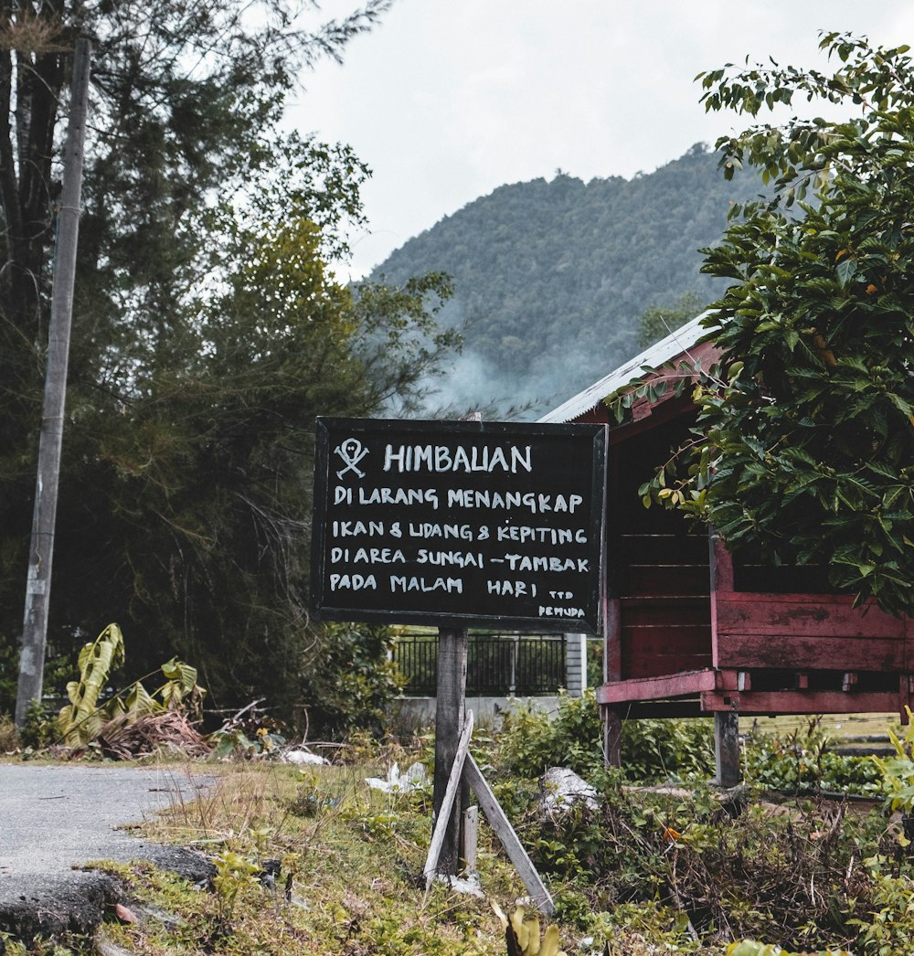 black and white wooden signboard