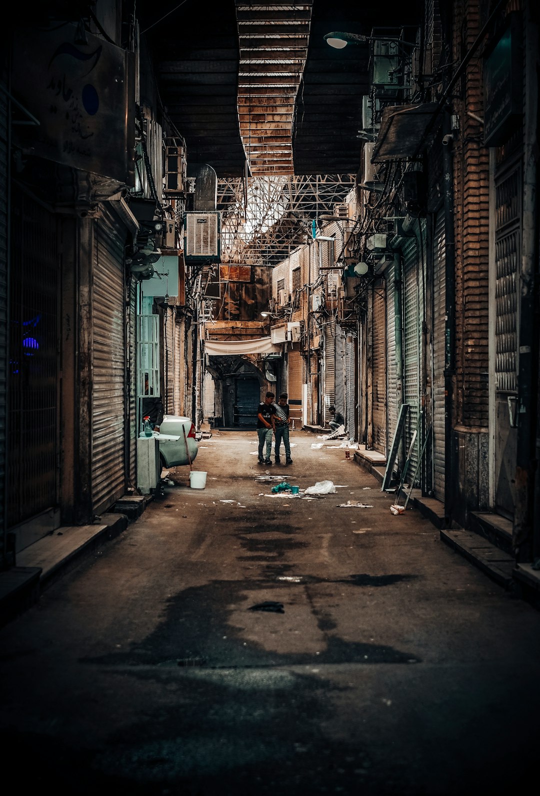 two men walking on street photo