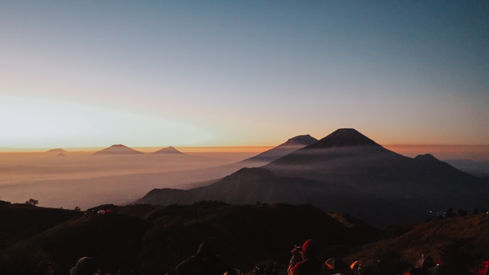 people across mountains