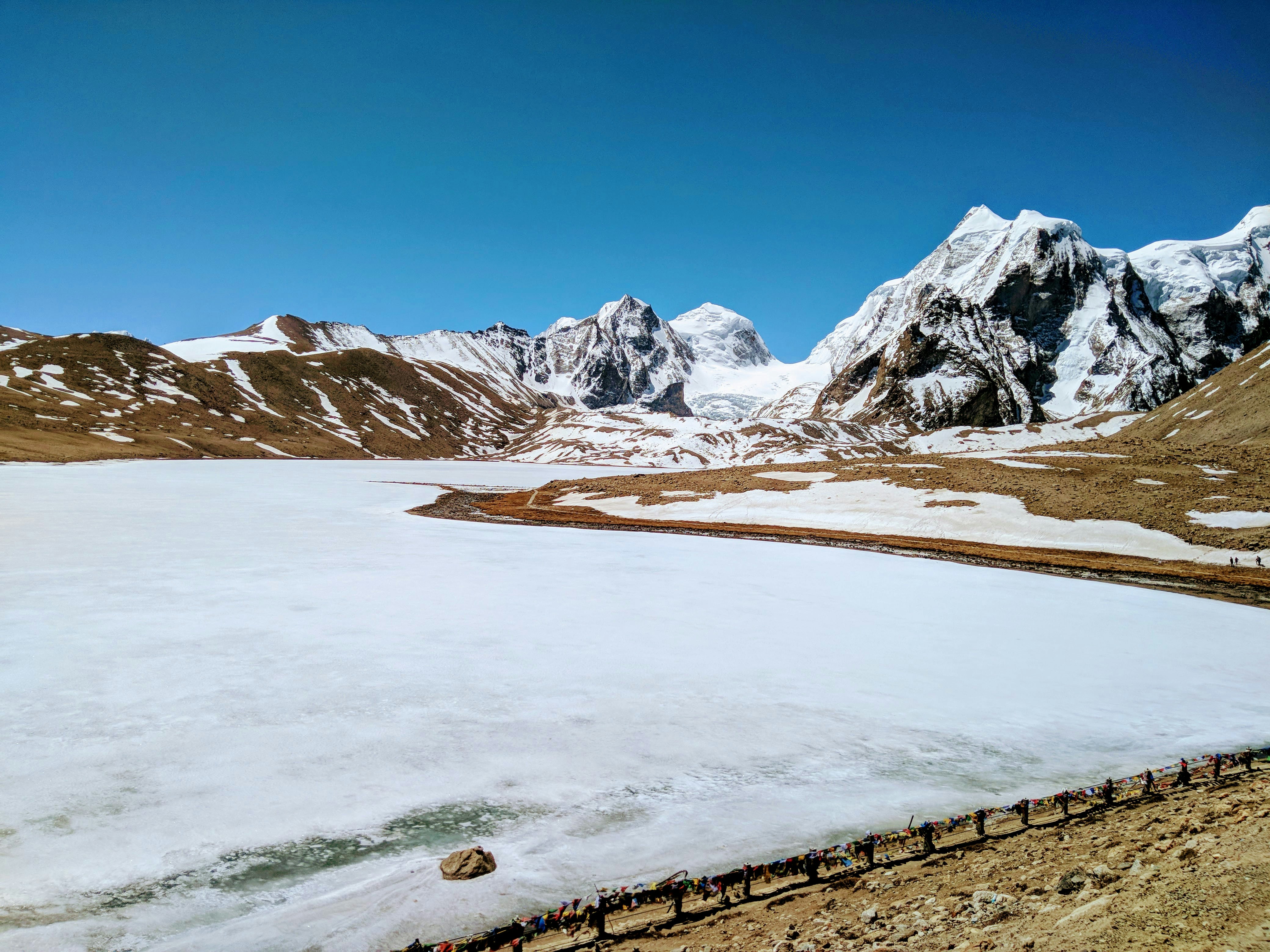 snow covered field during daytime