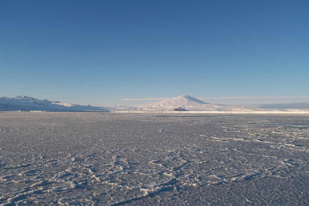 view of snowfield through snowy mountain