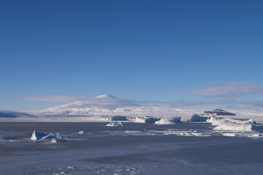 A breathtaking view of icy polar landscapes under a clear blue sky.