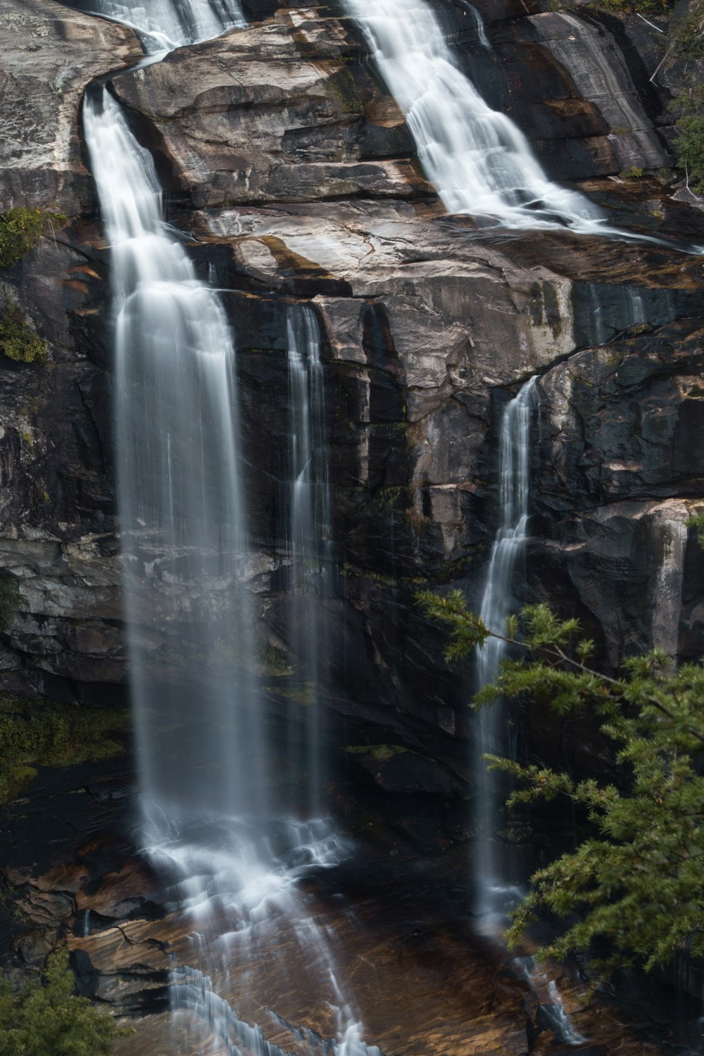 waterfalls on rocks during day