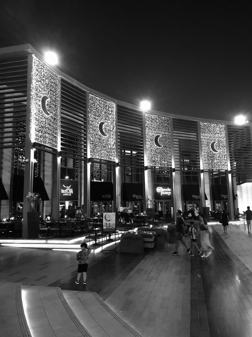 people walking near concrete buildings