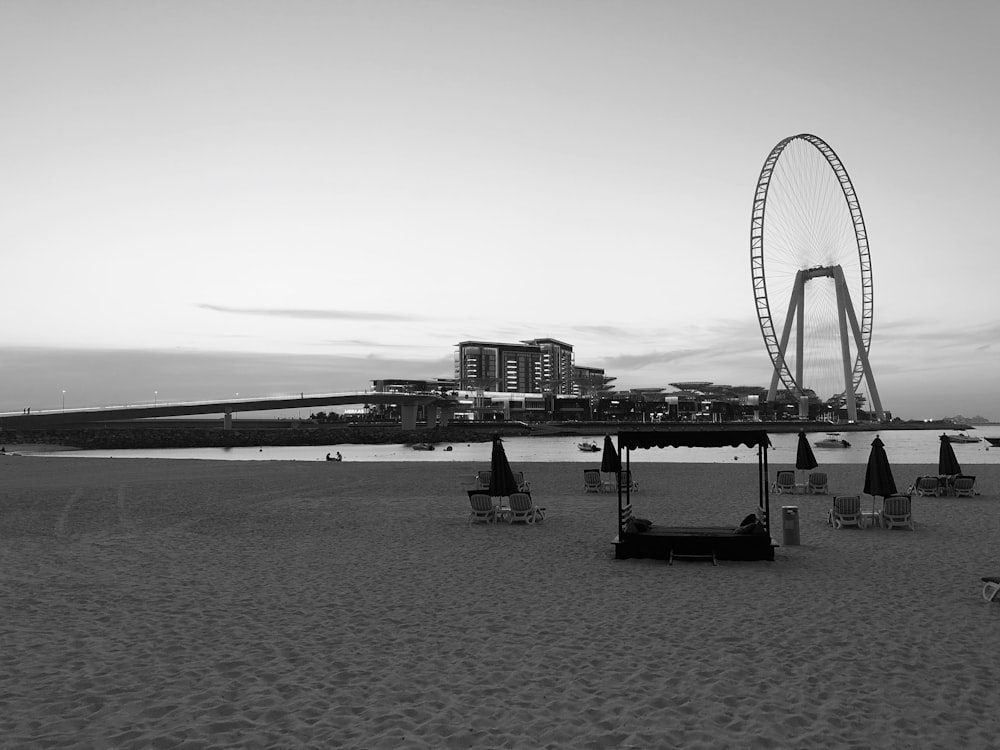 grayscale photo of umbrellas on beach