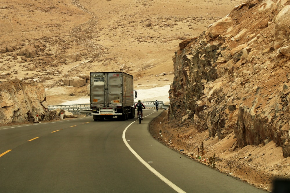 gray box truck at road during daytime