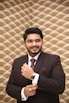 man wearing brown suit jacket