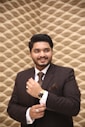man wearing brown suit jacket