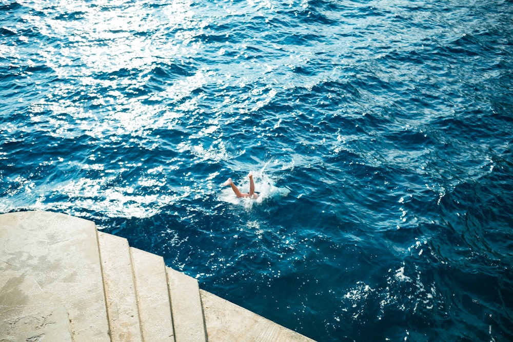 a person swimming in a body of water