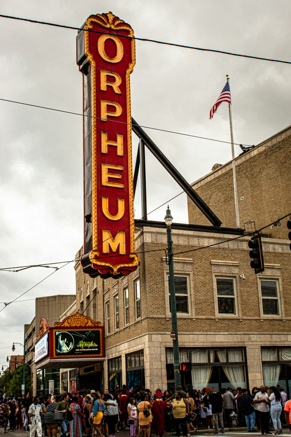 people gathering outside Orpheum building during daytime