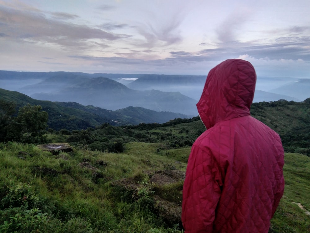 person wearing hooded jacket