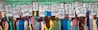 A mural depicting a group of people holding signs that read 'I Am A Man'. The figures are diverse, with a variety of clothing styles and colors. The background is composed of brick, and the mural uses vibrant, bold colors, emphasizing unity and strength.