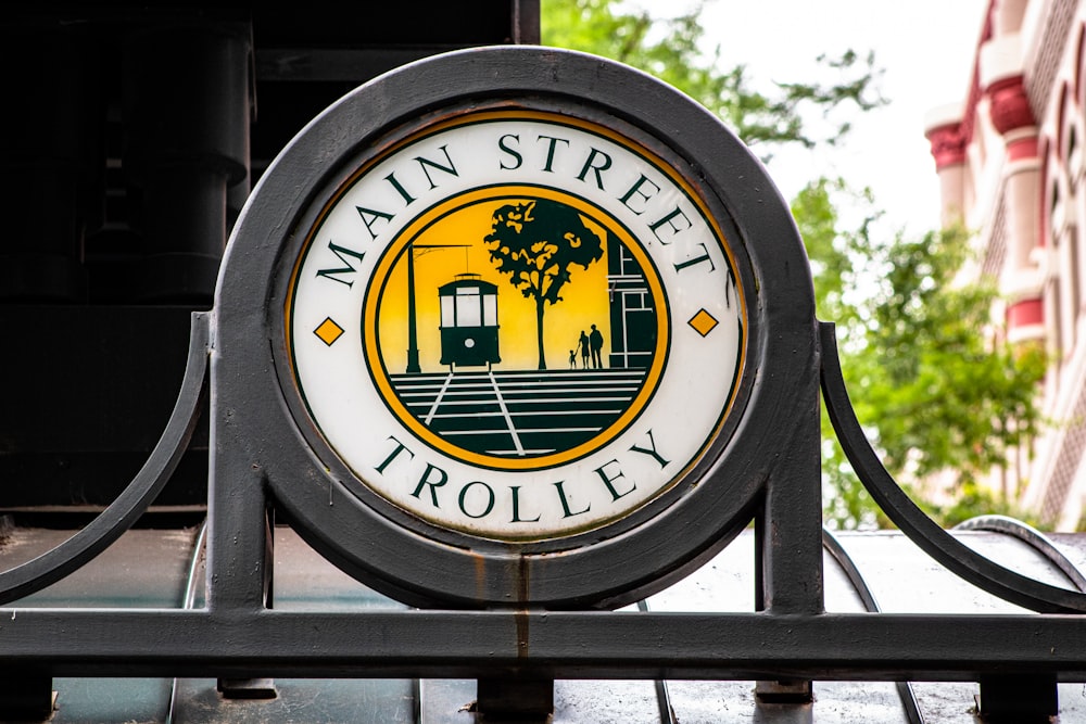 gray and white Main Street Trolley sign