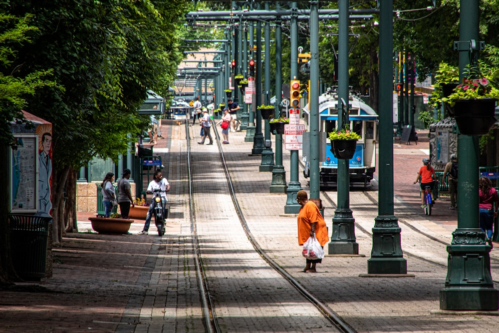 woman about to cross in tram rail