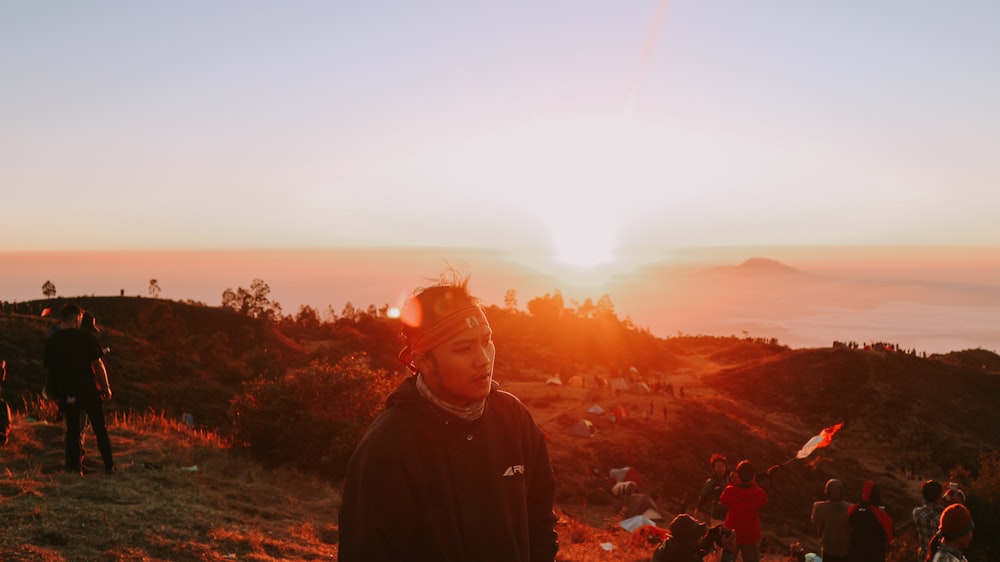 man standing on top of hill