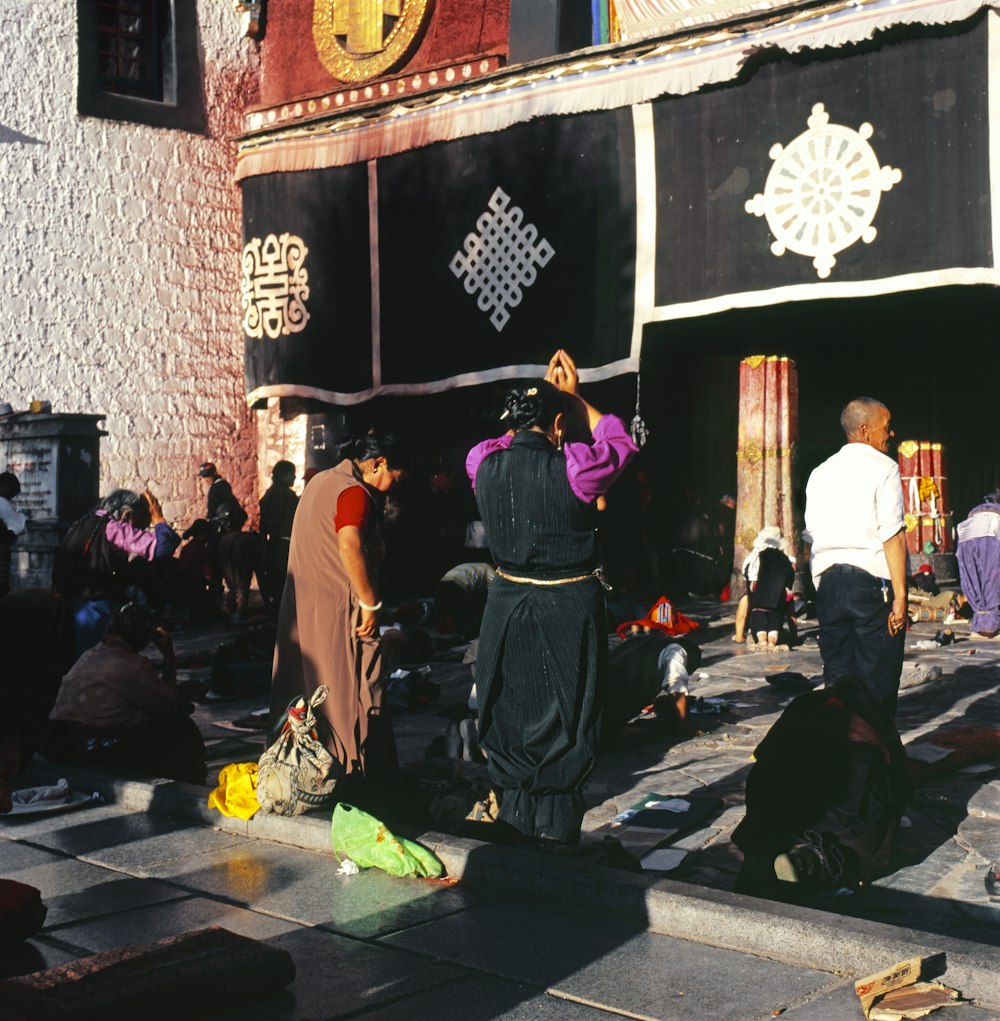 people praying outside temple