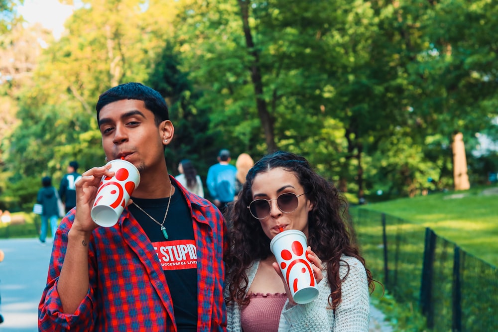 man and woman drinking soda