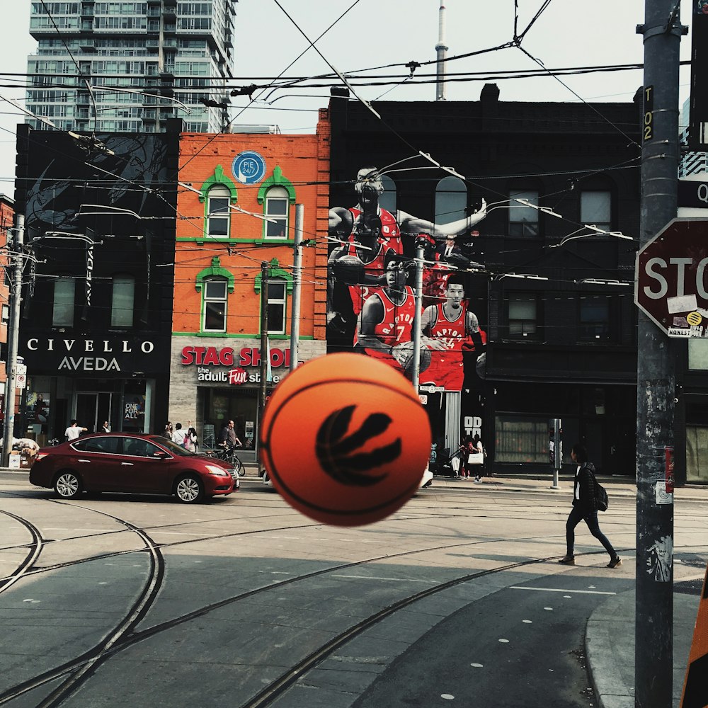 orange ball across Stag Salon