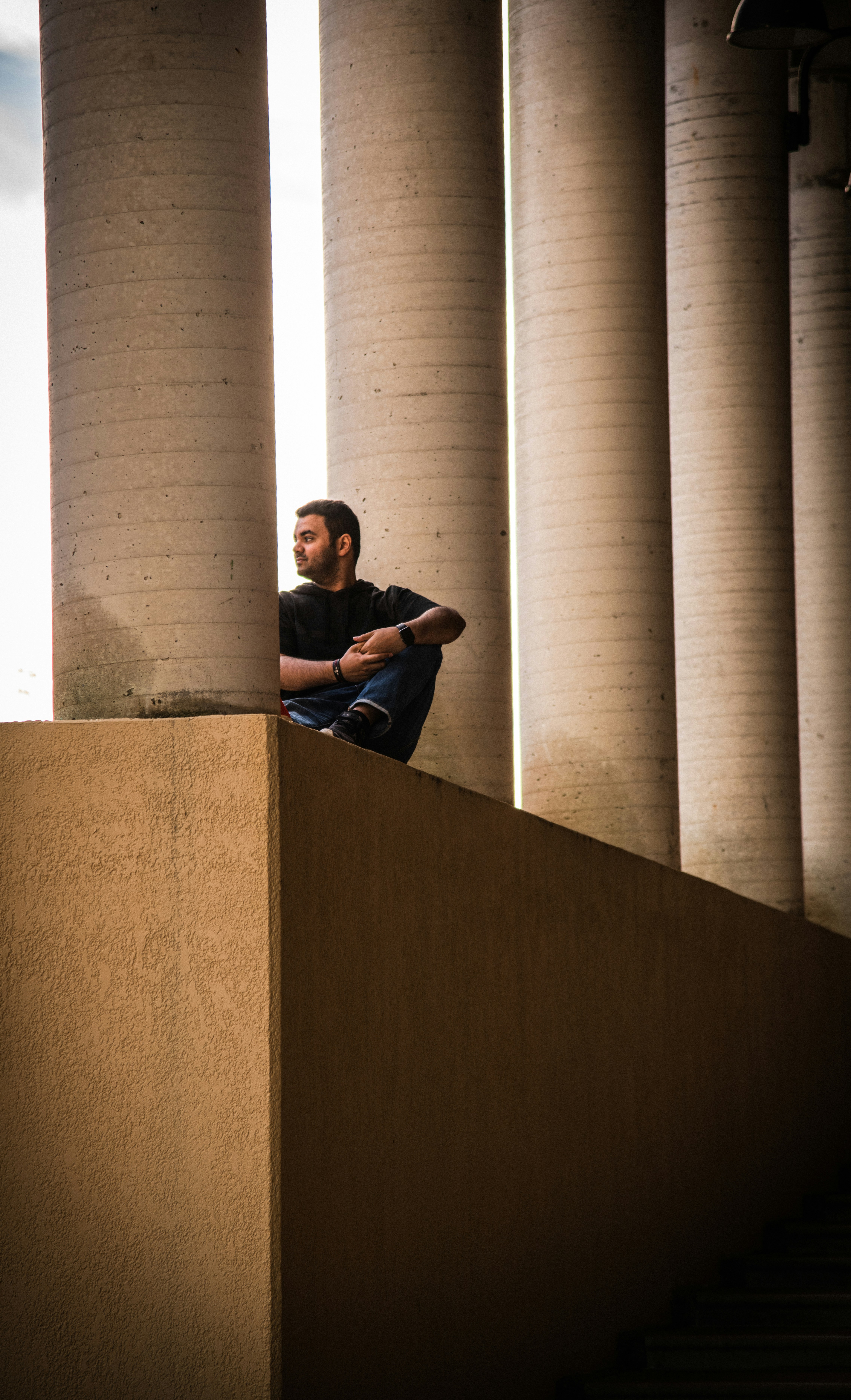 man sitting on wall