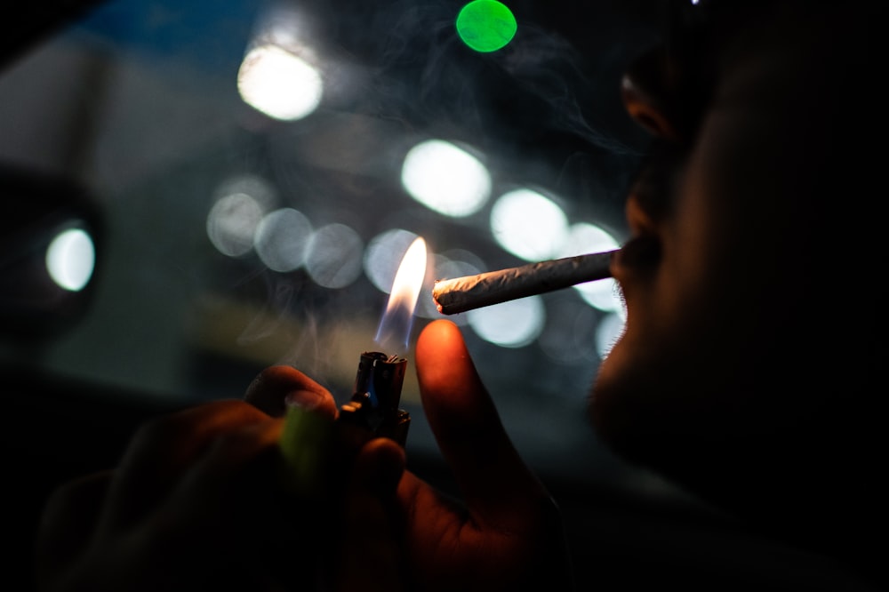 man lighting a cigarette