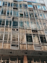 Image of a commercial building window installation in progress with precise craftsmanship.