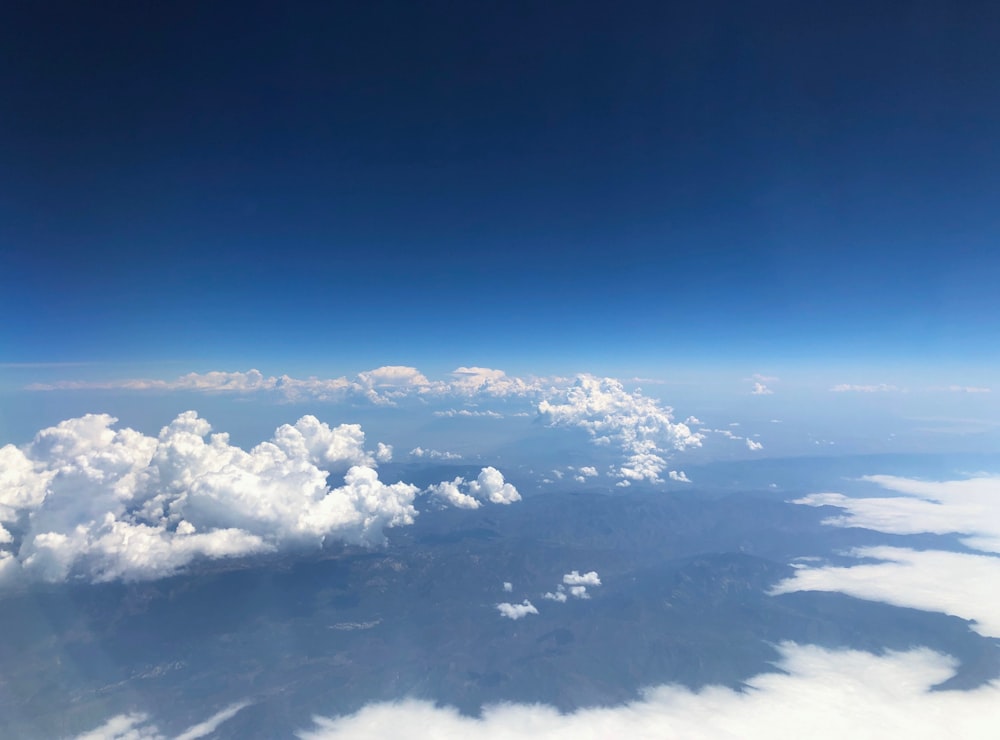 white clouds covering landscape below