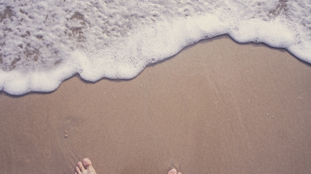 person standing on beach