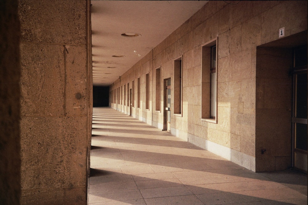 photo of brown building hallway