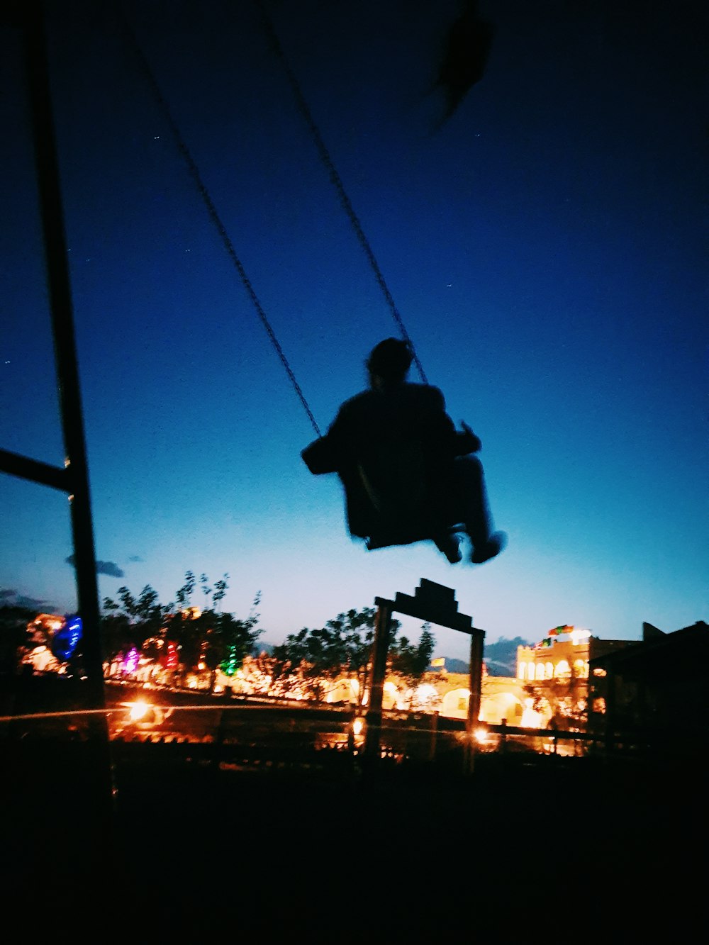 person riding on swing chair